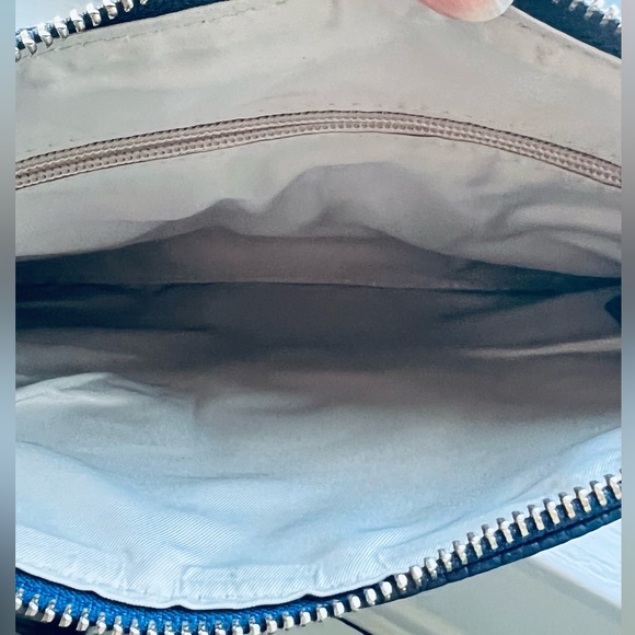 A navy blue shoulder and wristlet, adjustable strap to also wear as a crossbody - Picture 11 of 12